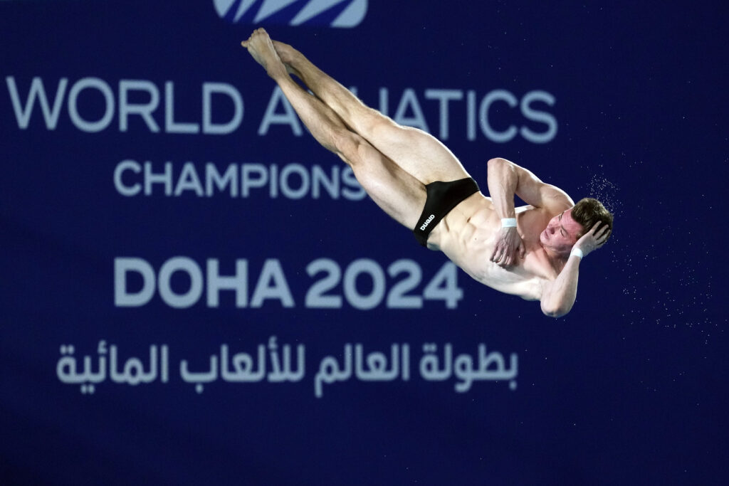 QATAR — Let's hope this posture is transitional: Yevhen Naumenko of Ukraine competes during the men's 10m platform diving preliminary at the World Aquatics Championships in Doha, Qatar, Friday, Feb. 9, 2024.Photo: Hassan Ammar/AP